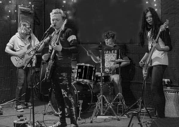 Three out of Four, the band of youngsters who have produced a cover version of Pink Floyd's Wish You Were Here for a local charity. Photograph: Zoe Meadows.