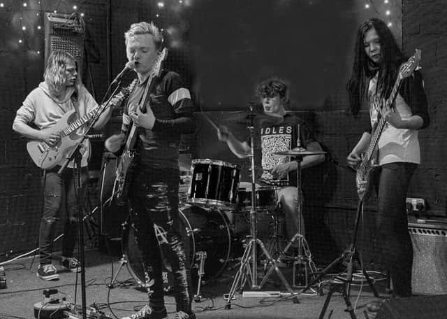 Three out of Four, the band of youngsters who have produced a cover version of Pink Floyd's Wish You Were Here for a local charity. Photograph: Zoe Meadows.