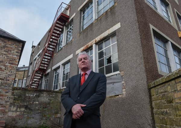 Councillor Davie Paterson outside Hawick's old Peter Scott factory.