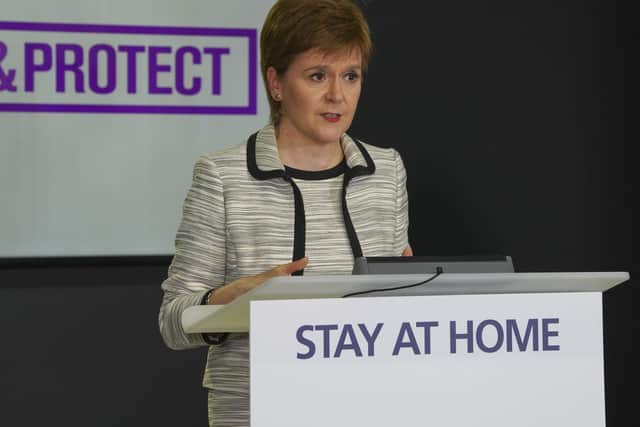 Nicola Sturgeon announcing a loosening of Scotland's lockdown laws today.