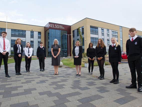Kelso High School head teacher Jill Lothian and Lesley Munro, service director, with head pupils on the first morning back to school.