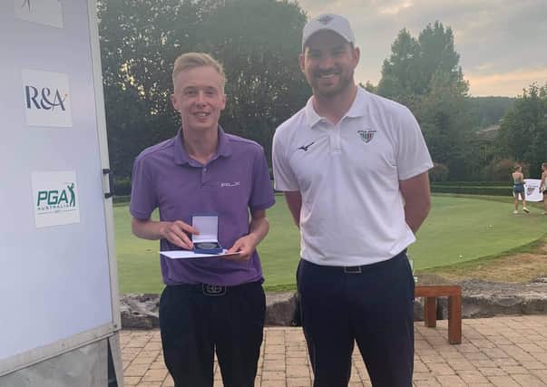 Jack is presented with his medal by Matthew Faldo, son of Sir Nick
