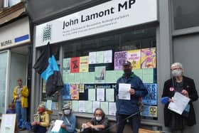 A protest by members of Extinction Rebellion outside John Lamont's constituency office in Hawick High Street.