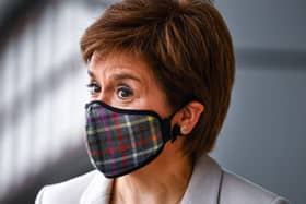 First minister Nicola Sturgeon wearing a tartan face mask  during a visit to shops in Edinburgh in June. Photo by Jeff J Mitchell/pool/AFP via Getty Images