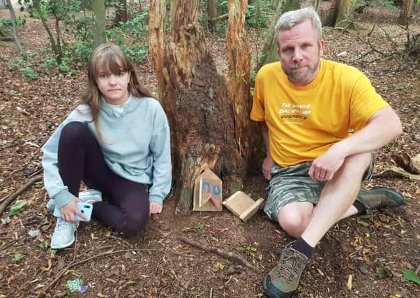 Lucy Johnston and her dad Douglas with their destroyed fairy house.