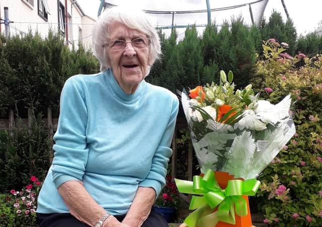 Scottish Borders Housing Association sent Jean Black flowers to mark her 60th year in Murray Place.