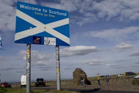 The MSPs want drivers going over the border to be given information on the Covid-19 regulation differences.