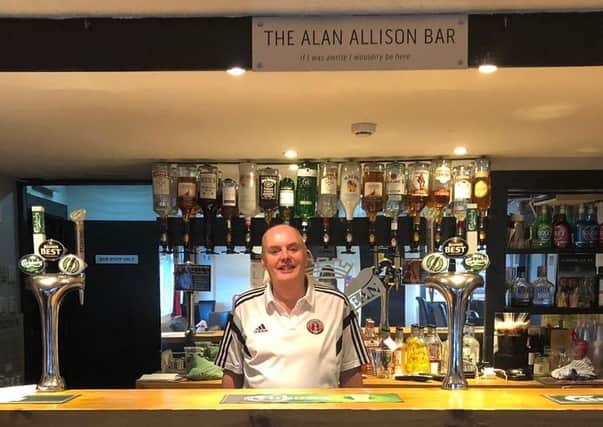 Alan Allison, behind the bar at Netherdale which now bears his name.