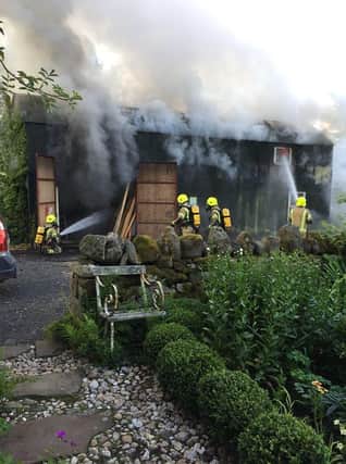 Firefighters tackle a blaze at Brian Falconer Engineering.
