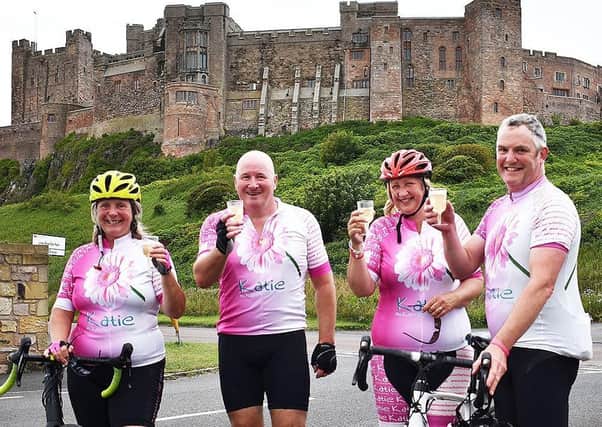 Journey’s end: Shirley, Kenny, Ann and Andrew celebrate their completion of their ride to Bamburgh.