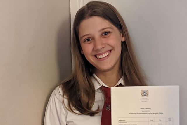 Peebles High School S4 pupil Anna Tweedy with her exam results.