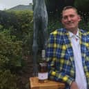 Doddie Weir with a bottle of Glenkinchie single malt whisky.