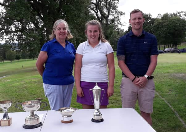Lily Towers, centre, who won the Ladies Gold championship, with Minto captains Janice Cambridge and Andrew Richardson