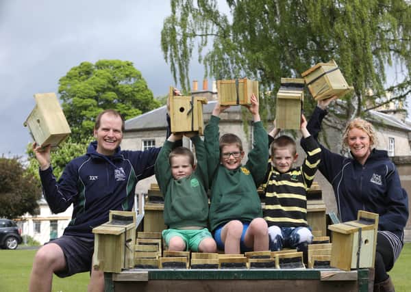 Tom Rawson has been making bird boxes for schools with his wife Emma and sons Fergus, 8, Hector, 6 and Lochie, 4.