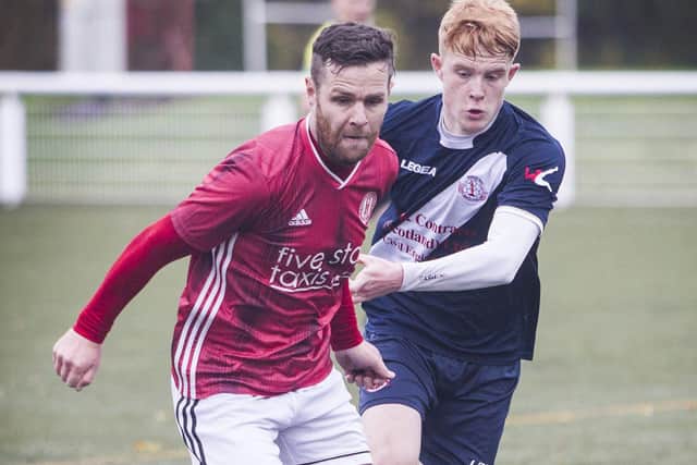 Ross Aitchison, Gala Fairydean Rovers' No 8, gets away from Jack Brydon of Civil Service Strollers. Photo: Bill McBurnie