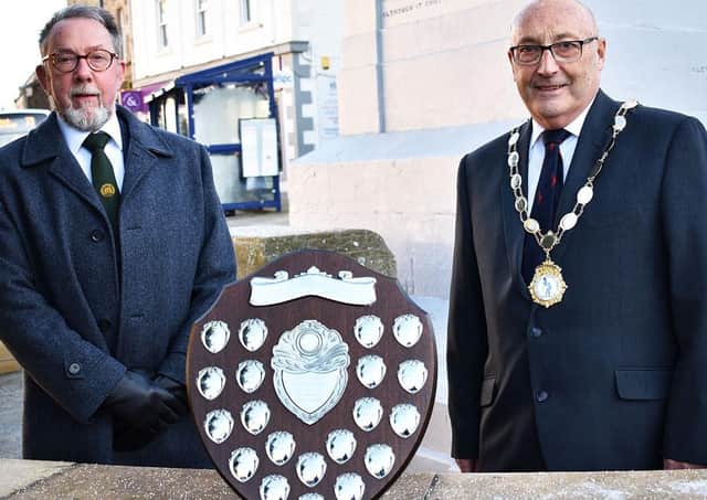 Selkirk Merchant Company Master Alistair Pattullo (left) presents the James Oliver Memorial Shield to Honorary Provost Keith Miller. Photo: John Smail.