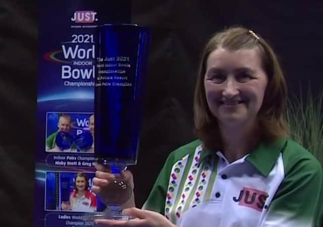 Julie Forrest celebrates winning the mixed pairs title at this year's World Indoor Bowls Championships, along with playing partner Stewart Anderson (BBC)