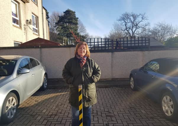 Carolyn Grant at one of the padlocked bollards in Cotgreen Road.