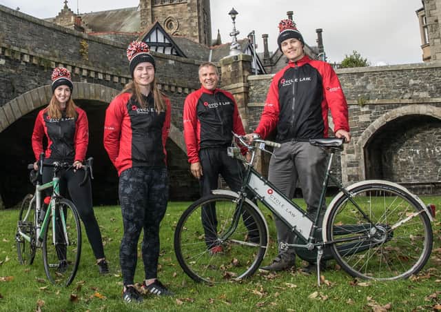 Cyclist Lucy Grant, second from left, with, from left Road Traffic Accident Law Scotland solicitor Zara Jones, marketing director Rod Mitchell and solicitor Thomas Mitchell. Photo: Ian Linton