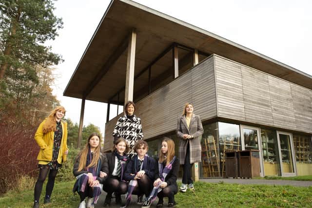 The Cashmere Collaborative outside Abbotsford Visitor Centre. Standing, from left, Eva Reed (Abbotsford), Debbie Paterson (Sinclair Duncan) and Annabel Le Gall (Heriot-Watt University), with the winning team of girls from Earlston High School.