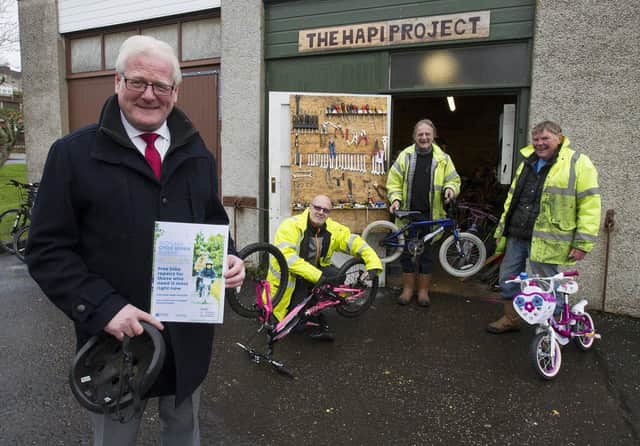 Councillor Stuart Marshall at Hawick's Hapi Centre with project worker Ged Smith and volunteers, Richard Blisga and Ian Murdie. (PHOTO: BILL McBURNIE)