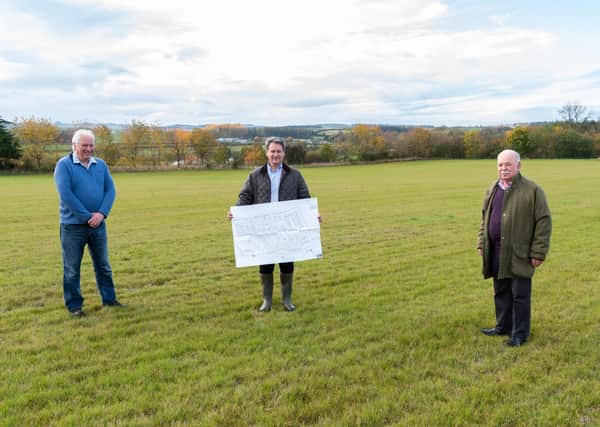 Applicant Chris Gregg at the site, flanked by councillors Donald Moffat and John Greenwell.