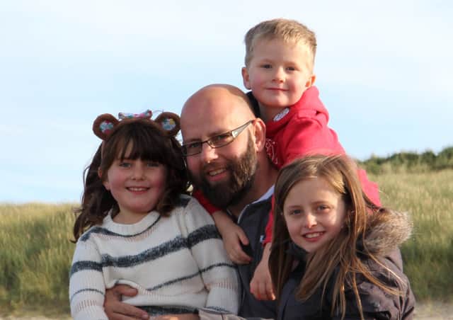 Andrew Slorance with younger children Olivia, left; Millie, right; and Finlay, top, on Iona.