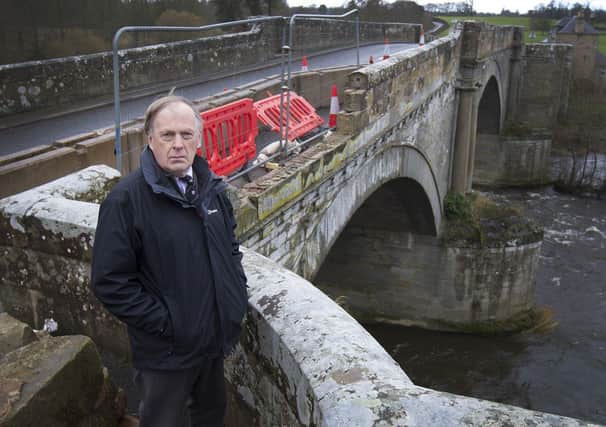 Councillor Euan Robson at The Teviot Bridge, Kelso which was damaged when struck by an HGV. (PHOT: BILL McBURNIE)