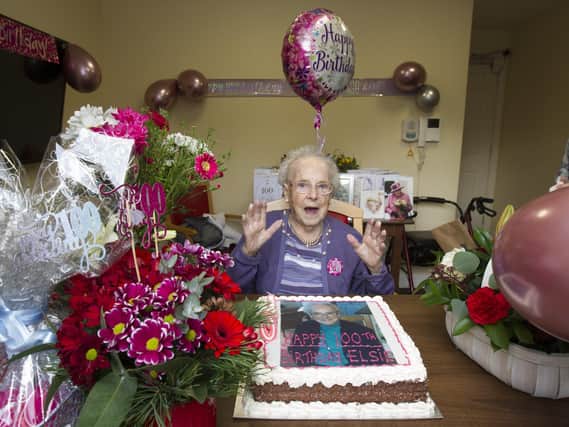 Elsie Leithead surrounded by flowers and Cards, including her card from Her Majesty in pride of place. (PHOTO: BILL McBURNIE)