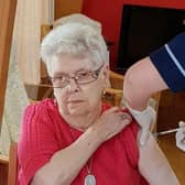 Ann Slater, who lives at St Ronan's Care Home in Innerleithen, receives her vaccine.