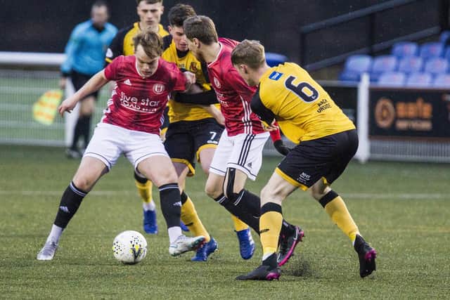 Gala Fairydean Rovers central midfielder Archie Roue up against Annan on Boxing Day. Photo: Bill McBurnie