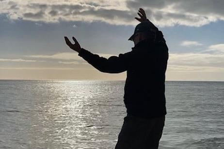 Qigong on Eastbourne beach, taken by Karen Bailey with an iPhone. SUS-220216-101845001