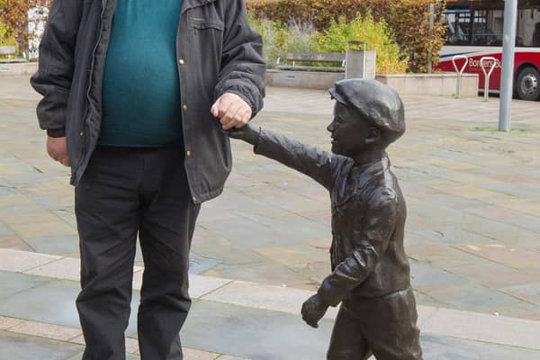Councillor Sandy Aitchison with the wee man in Galashiels. (Photo: Bill McBurnie)