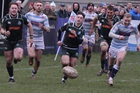 Hawick and Edinburgh Academical players chasing a loose ball during the former's 23-12 Scottish cup second-round win at the capital's Raeburn Place on Saturday (Photo: Malcolm Grant)