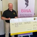 Richard Forsyth, senior agent at NFU Mutual Borders presents the cheque to Carol Walker, service manager at Border Women’s Aid.