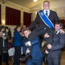 Kelsae Laddie Callum Davidson is lifted aloft by Sean Hook and Mark Henderson into the reception at the Tait Hall. Photo: Bill McBurnie.