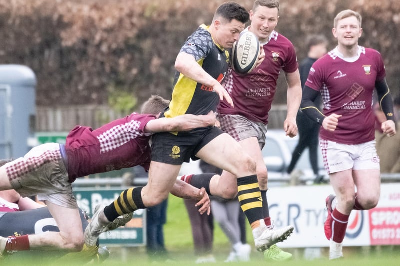 Melrose's Struan Hutchison being tackled by Gala during Kelso Sevens' final on Saturday