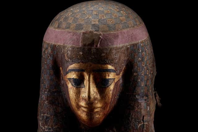 The Egyptian Ptolemaic gilt cartonnage mask.
