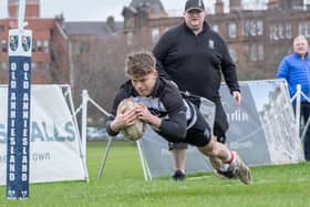 Nik Stingl scoring a try for Kelso at Glasgow High Kelvinside on Saturday as his club's director of rugby, Neil Hinnigan, looks on (Photo: Charles Brooker)