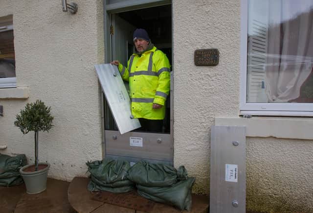 Glen Clayton outside his flooded home at Crowbyres. (Photo: BILL McBURNIE)