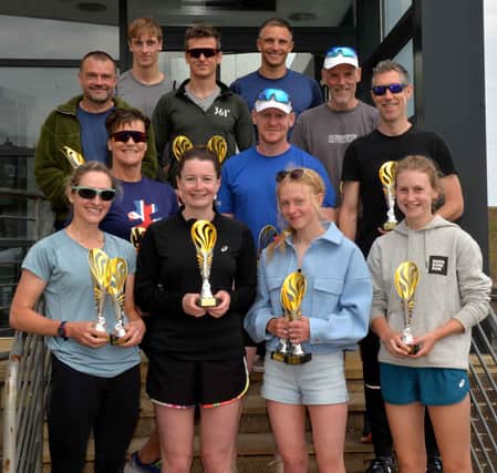 Live Borders Eyemouth triathlon category winners, front from left, Sarah Russell, first female over-40 veteran; Joanne Mulford, first senior female; Eilidh Miller, first female finisher overall; and Ava Macleod, female come-and-tri winner, with, behind them, Joyce Mark, female vintage winner; Sandy Walker, first Live Borders member; and David Cooper, come-and-tri winner, and next row back, Samuel Vassie, open junior winner, and John Soutar, open runner-up, and, back, Jonathan Taylor, open superveteran winner; Iain Veitch, overall winner; and Eddie Turnbull, open vintage winner. Missing are Polly Brennan, winner of the female superveteran category, and Peter Gardner, open third overall