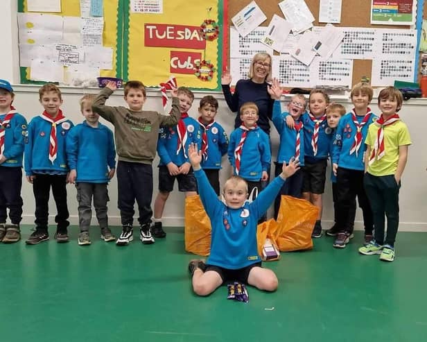 ​Fiona Dalgleish receives donations from a local scout group