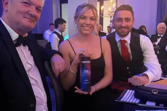 John Robertson, Shannon Taitt and Stewart Robertson with the Manufacturer of the Year award.