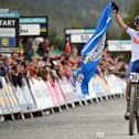 Great Britain's Tom Pidcock celebrating winning the men's elite cross-country Olympic mountain bike race during this year's UCI world championships at Glentress Forest on Saturday (Photo by Andy Buchanan/AFP via Getty Images)