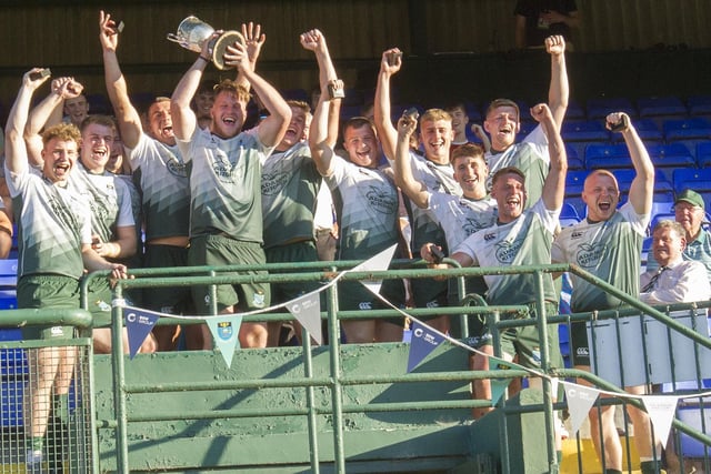 Hawick players holding aloft the trophy after winning their sevens tournament