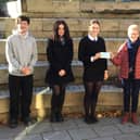 George Wilson and Edith Scott hand over the cheque for £900 to the school's present day pupils.