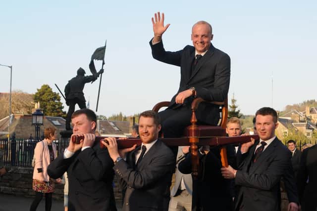 Royal Burgh Standard Bearer Adam Nichol arrives at the Victoria Hall, carried by his attendants. Photo: Grant Kinghorn.