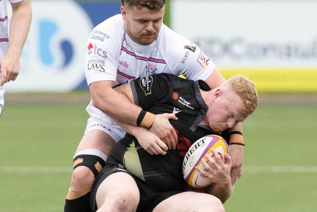 Southern Knights' Fraser Renwick being tackled by Ayrshire Bulls' Tom Lambert at the Greenyards in Melrose at the weekend (Photo by Bruce White/SNS Group/SRU)