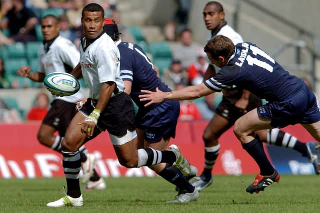 Waisale Serevi evading an attempted tackle by Clark Laidlaw during an IRB London 7s tournament game between Fiji and Scotland at Twickenham Stadium in London in 2005 (Photo by Matthew Lewis/Getty Images)