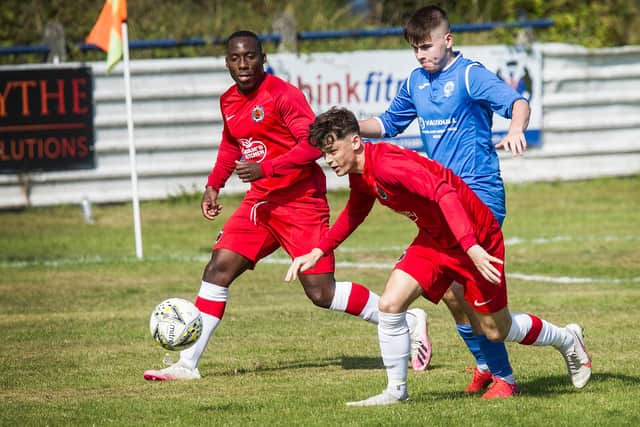 Hawick Royal Albert United's Greg Ford on the ball against Golspie Sutherland, supported by Joe Ngoa (Pic: Bill McBurnie)